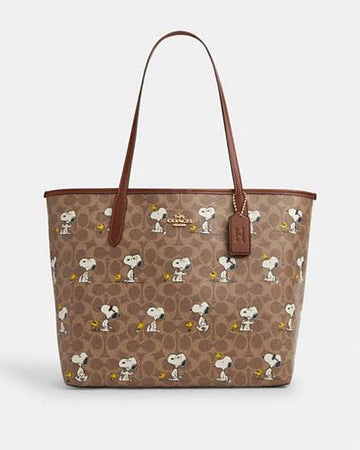 Coach X Peanuts City Tote Bag In Signature Canvas With Snoopy Print